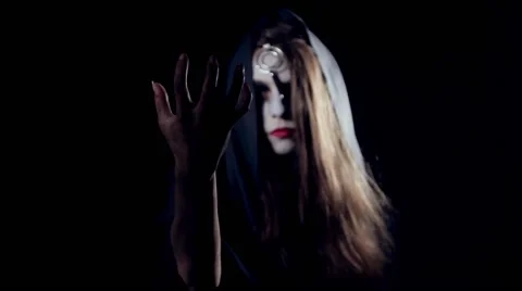 Halloween scary girl casting a spell Stock Footage