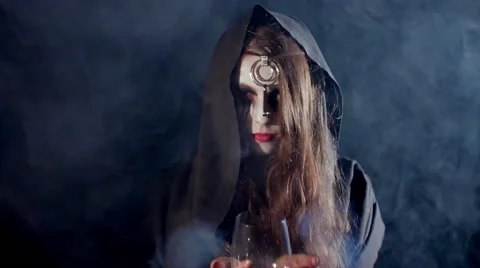 Halloween scary witch with a glass Stock Footage