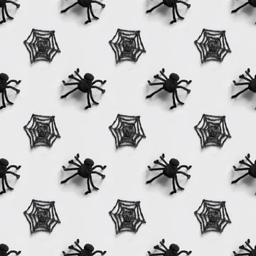 Halloween seamless pattern of black spiders and cobweb. Stock Photos
