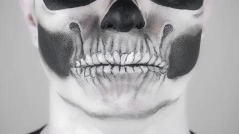 Halloween skeleton man. Close-up of lips Vídeo Stock 139291620