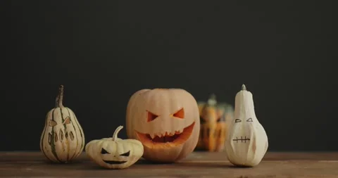 Halloween spooky pumpkins on the table Stock Footage 140880701