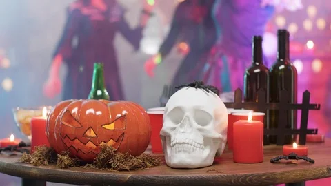 Halloween still life decor elements on a table at a halloween party Stock Footage 107972019