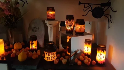 Halloween table. full of orange lights and candles Stock Footage 71779224