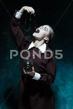 The Halloween theme: crazy girl with snakes Stock Photos