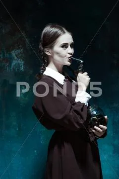 The Halloween theme: crazy girl with snakes Stock Photos