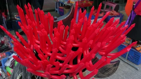 Halloween theme red devil pitchfork costume accessories are being sold at Stock Footage 164034367