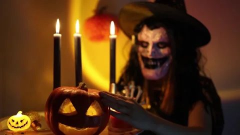 Halloween transforms an ordinary evening with scary costumes masks and pumpkins Video stock 346147794