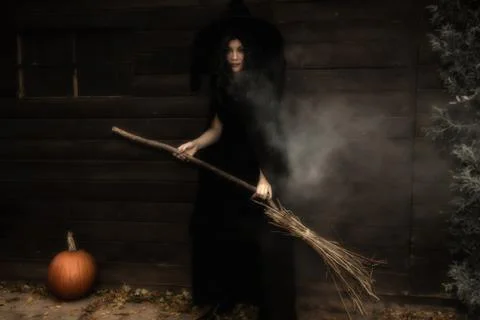 Halloween Witch in Front of House Stock Photos