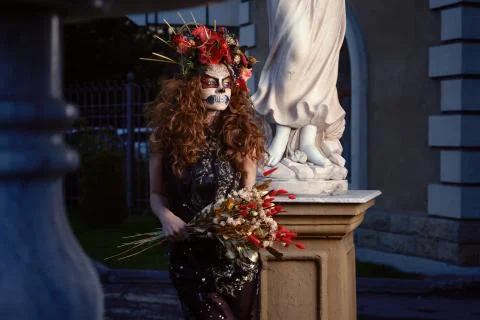 Halloween Witch with a magic in a dark Old Spooky cemetery. Stock Photos