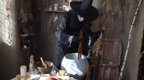 Halloween witch preparing potion in the boiler Stock Footage 67897173