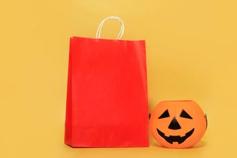 Halloween.Eco friendly red paper shopping and delivery bag mock up and pumpki Stock Photos