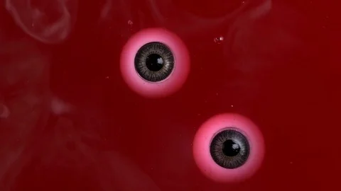 Halloween,eyes floating from the red liquid in the cauldron of the witch Stock Footage 82247916