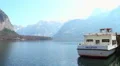 Hallstatt ferry for tourist transportation across mountain lake HD Footage