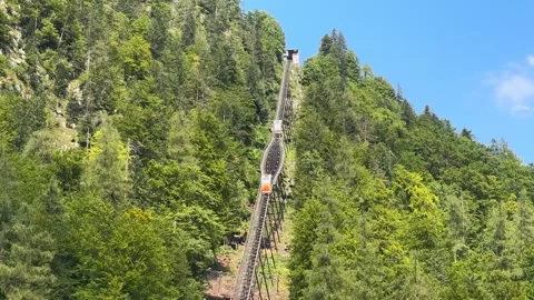 Hallstatt funicular cablecar train rails in Alps Austria Stock Footage 315056845
