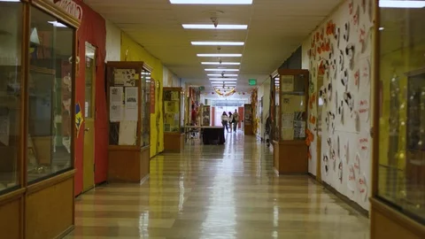 Hallway Of An American High School Tracking POV Stock Footage