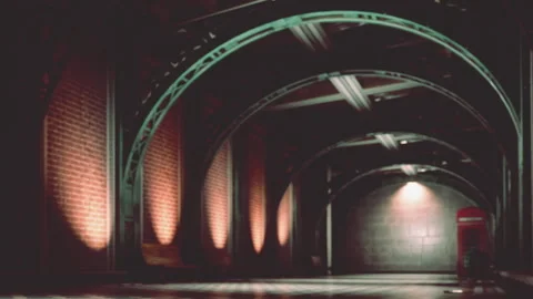 A hallway with brick walls and a red telephone booth in a city Stock Footage 344849472