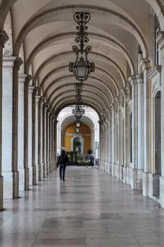 Hallway with columns surrounding the Commerce Square in Lisbon, Portugal Stock Photos