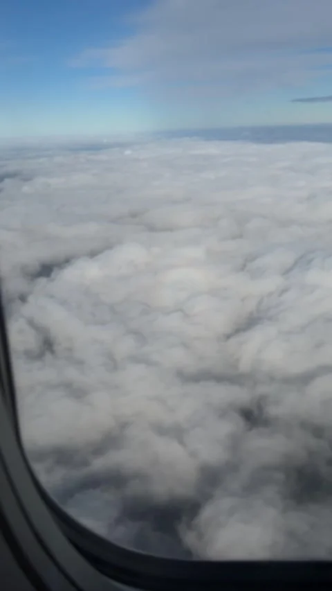 Halo effect seeing from airplane window flying over Poland. Vertical video Stock Footage 255901744
