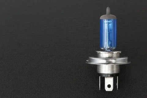 Halogen auto lamp, close-up of car headlight bulb on black background Foto stock