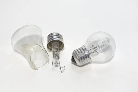 Halogen bulb near the split filament lamp Stock Photos