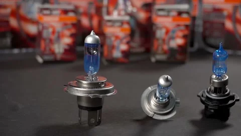 Halogen bulbs with silvery cap for car, panning Stock Footage 161045176