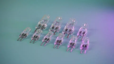 Halogen capsule lamps in two rows at an angle. 스톡 사진