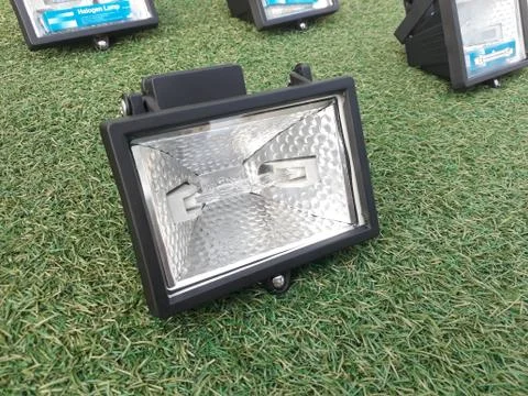 Halogen lamp on grass Stock Photos