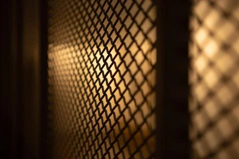 Halogen lighting and wire mesh. Stock Photos