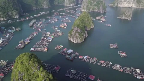 Halong Bay and its floating village from above during golden hours Stockbeeldmateriaal 123712600
