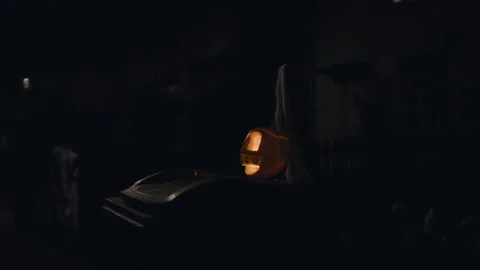 Haloween jack o latern on a scary night on top of a dust bin Stock Footage 291620613