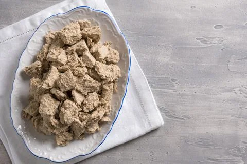 Halva or halvah on plate on the table. Stock Photos