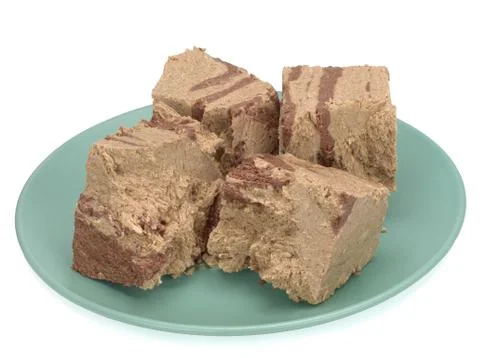 Halva in a plate on White Background Stock Photos