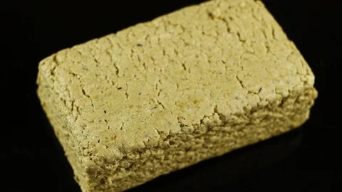 Halvah piece on black background Stock Footage 121722735