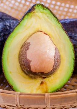 Halved avocado with core isolated on white - in macro shot.. Stock Photos