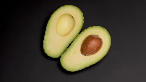 Halved avocado Stock Footage 309907192