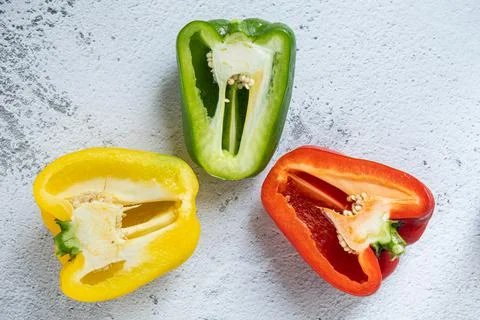 Halved bell pepper with white background Stock Photos