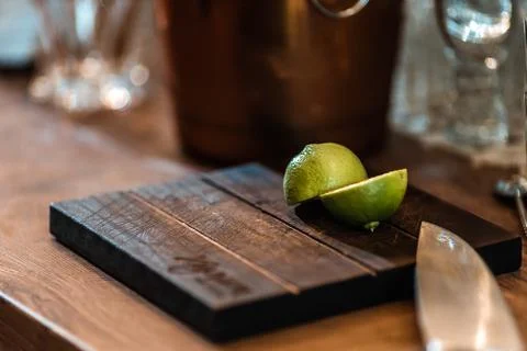 Halved fresh lime on a cutting board in tha bar Stock Photos