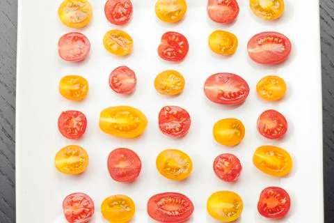 Halved grape tomatoes Stock Photos
