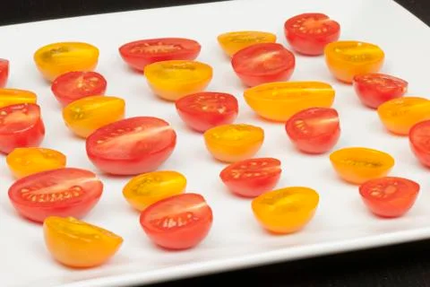 Halved grape tomatoes, side view Stock Photos