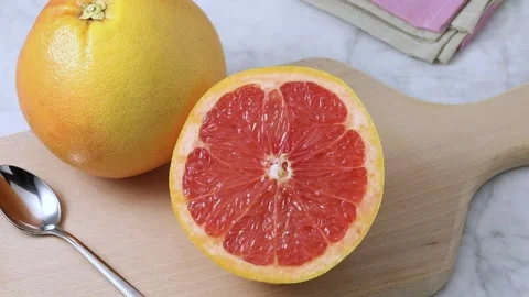 Halved juicy red grapefruit close up Stock Footage 172141996