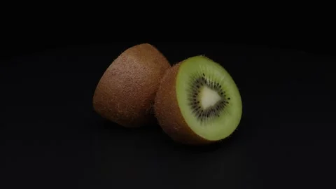 A halved kiwifruit. 스톡 동영상 327303664