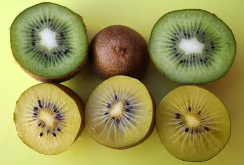Halved kiwis Stock Photos