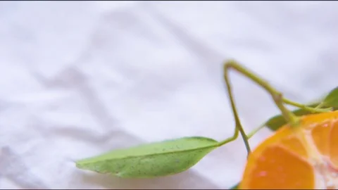 Halved orange on cloth Vídeos de archivo 76137480