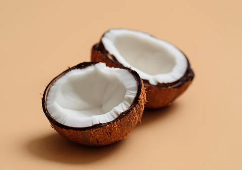 Halved organic coconuts. Stock Photos