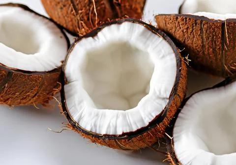 Halved organic coconuts. Stock Photos