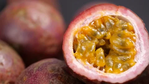 Halved Passion Fruit dolly shot in slow motion. Exotic fruit for healthy eating Stock Footage 142774943