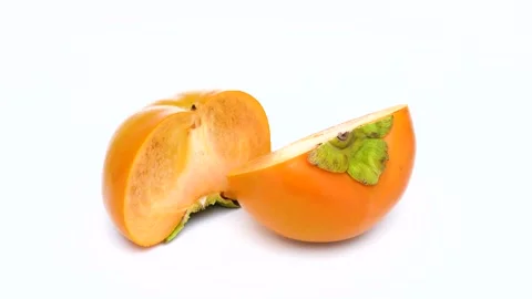 Halved persimmon Stock Footage 315497819