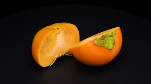 Halved persimmon Stock Footage 315497839