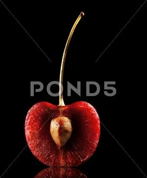 Halved red cherry Stock Photos