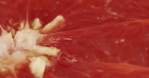 Halved red pomelo fruit closeup rotating Stock Footage 199090428